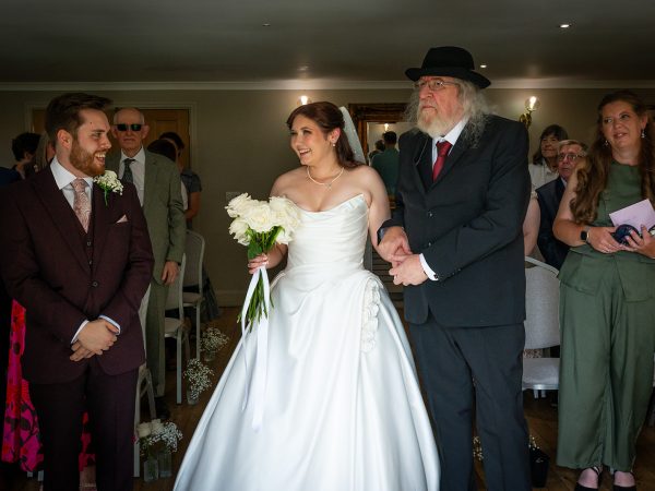 Adam and Abbey’s wedding at Tottington Manor – bride walking down the aisle with her father