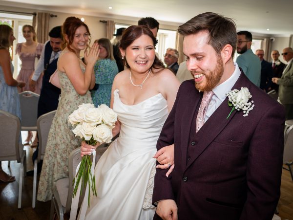 Adam and Abbey’s wedding at Tottington Manor – just married walking back down the aisle