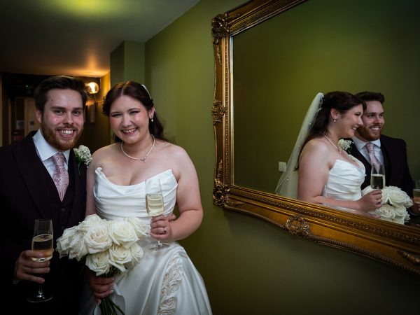 Adam and Abbey’s wedding at Tottington Manor – newlyweds with a mirror reflection