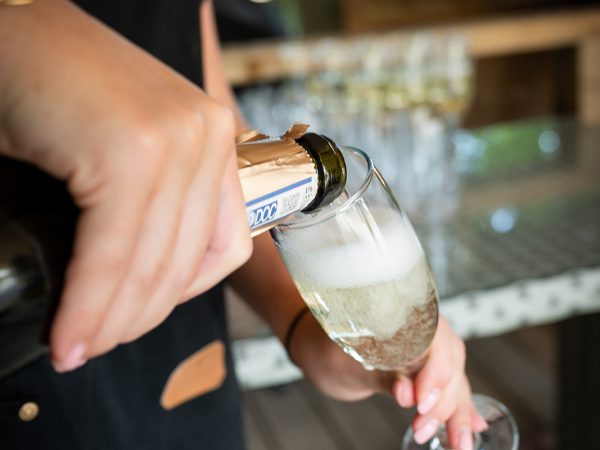 Adam and Abbey’s wedding at Tottington Manor – drinks being poured by Terra