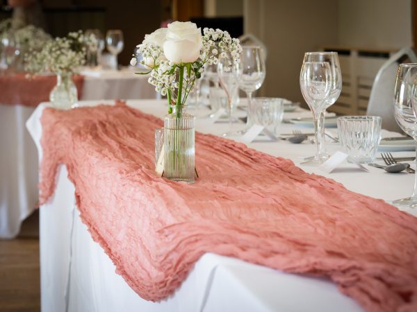Adam and Abbey’s wedding at Tottington Manor – table styling with a coral runner