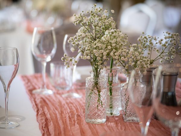 Adam and Abbey’s wedding at Tottington Manor – table setting with flowers and glasses