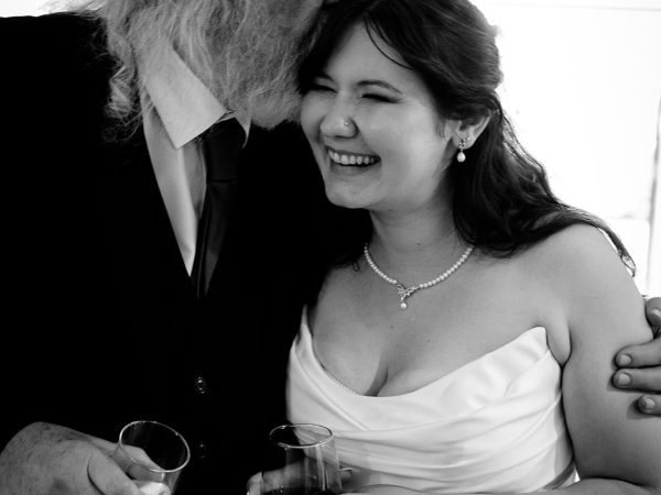 Adam and Abbey’s wedding at Tottington Manor – bride and her father sharing a laugh