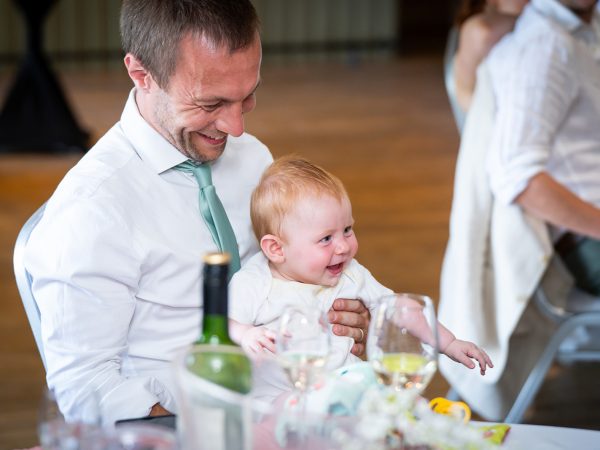 Adam and Abbey’s wedding at Tottington Manor – guest with a baby at the reception