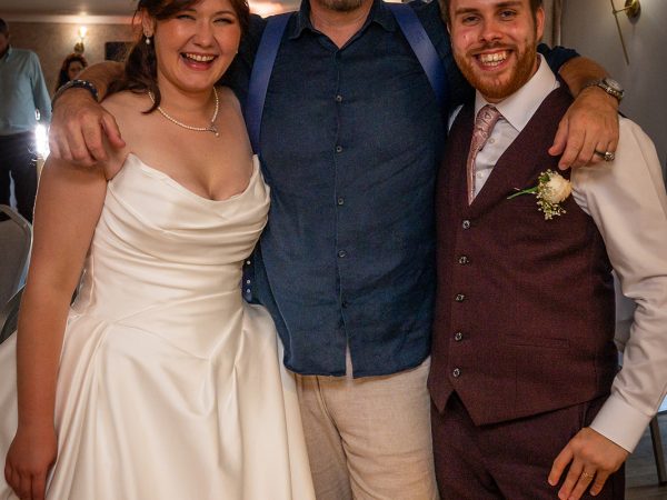 Adam and Abbey’s wedding at Tottington Manor – couple with a guest