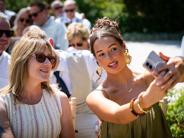 Holly and Andy’s wedding at Field Place – guests taking a selfie before the ceremony