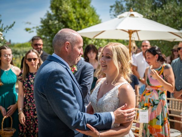 Holly and Andy’s wedding at Field Place – groom greeting his bride at the aisle