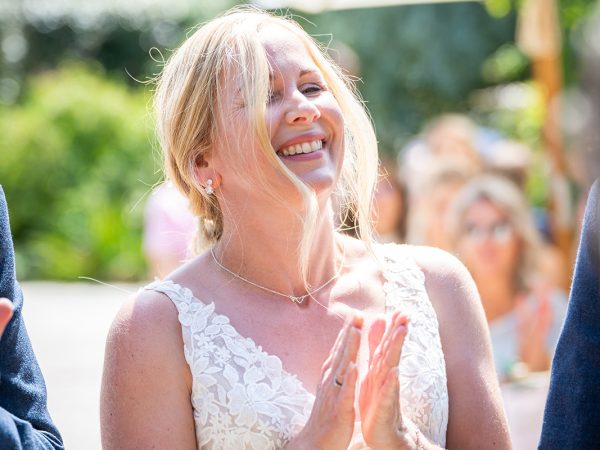 Holly and Andy’s wedding at Field Place – bride's joy at the ceremony