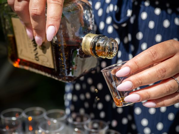 Holly and Andy’s wedding at Field Place – pouring drinks for a toast