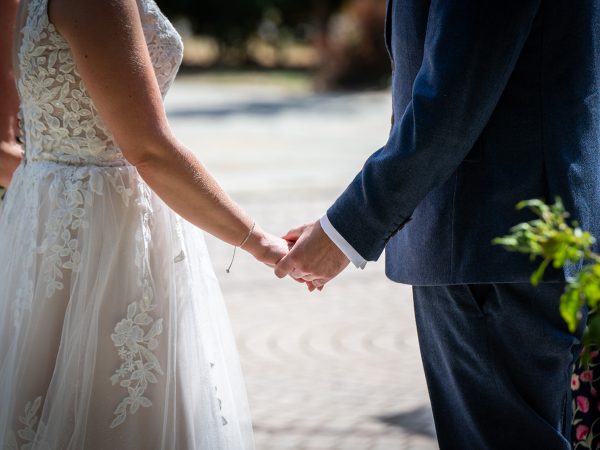 Holly and Andy’s wedding at Field Place – holding hands during the vows