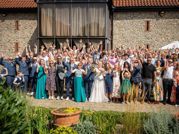 Holly and Andy’s wedding at Field Place – group photo outside the barn