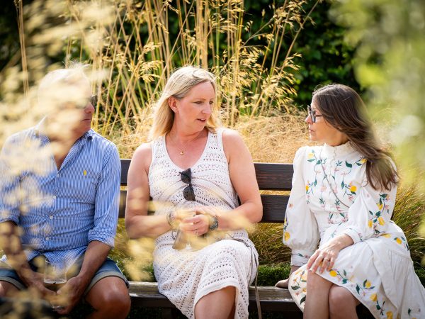 Holly and Andy’s wedding at Field Place – guests relaxing in the garden