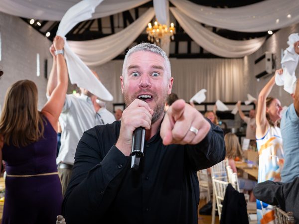 Holly and Andy’s wedding at Field Place – singing waiter performing
