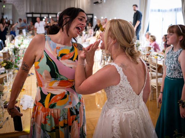 Holly and Andy’s wedding at Field Place – bride singing along with friends