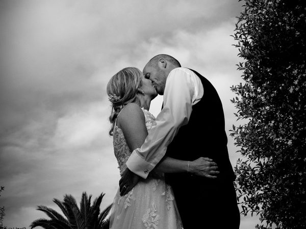 Holly and Andy’s wedding at Field Place – a black and white kiss