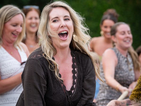 Holly and Andy’s wedding at Field Place – guests pulling in the tug of war