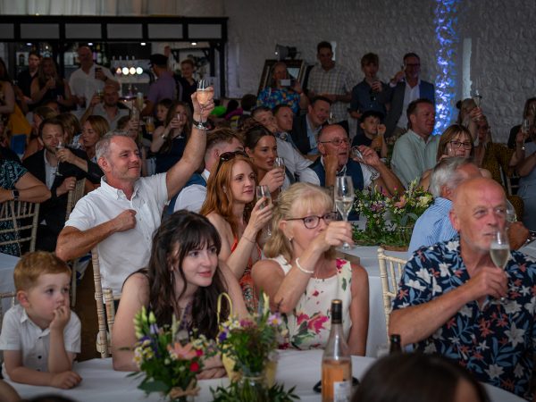 Holly and Andy’s wedding at Field Place – guests laughing at the speeches