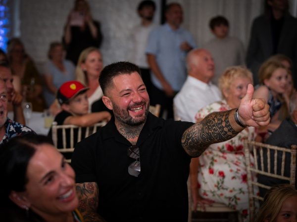 Holly and Andy’s wedding at Field Place – guests laughing at the speeches